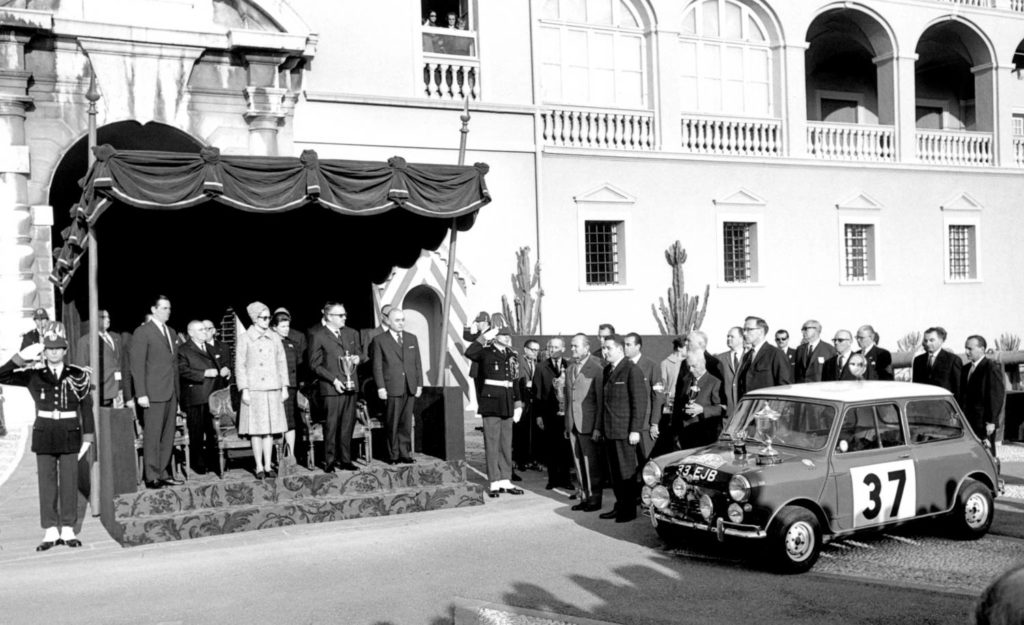 Paddy Hopkirk and the Mini collect their winners trophies