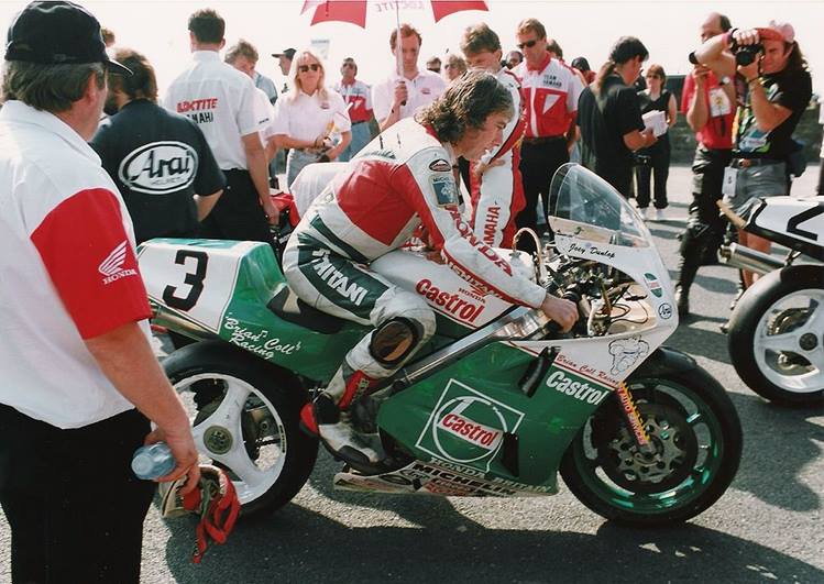 Joey Dunlop sits on his Honda RC30 