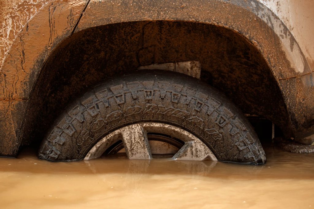 Driving the 2020 Land Rover Defender proves it's ready to conquer the world again_wading in a river_Hagerty_