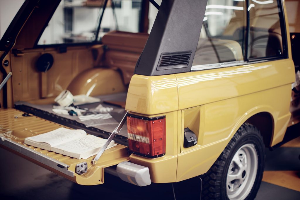 The signature split-fold tailgate of the original Range Rover_Hagerty