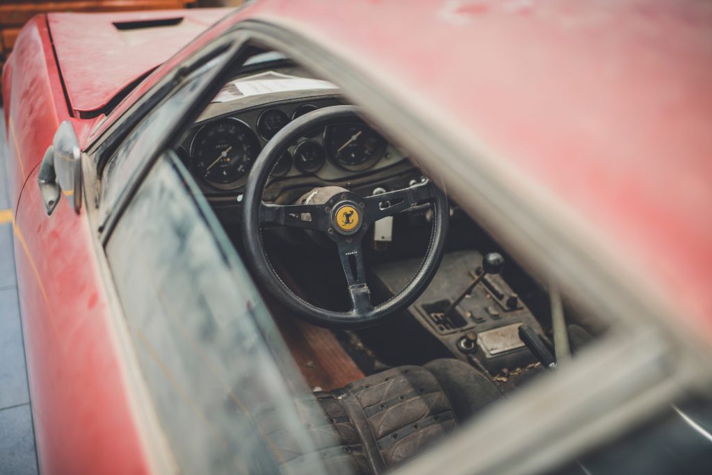 A dusty Daytona awaits restoration at the Ferrari Classiche workshop_Hagerty