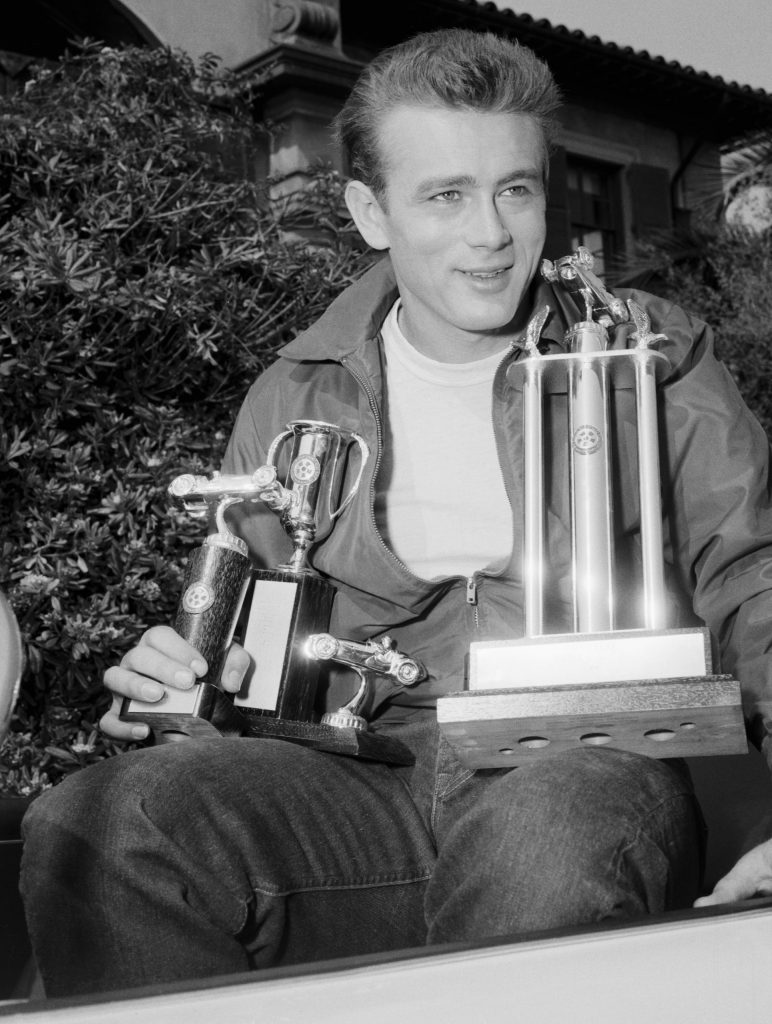 James_Dean_Holding_Racing_Trophies