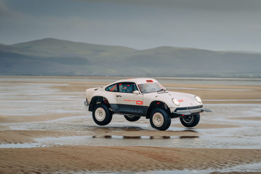 Porsche 911 Singer ACS jumping sand dunes