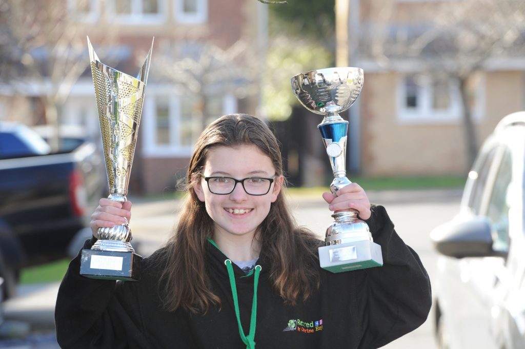 Catherine Potter with karting trophies