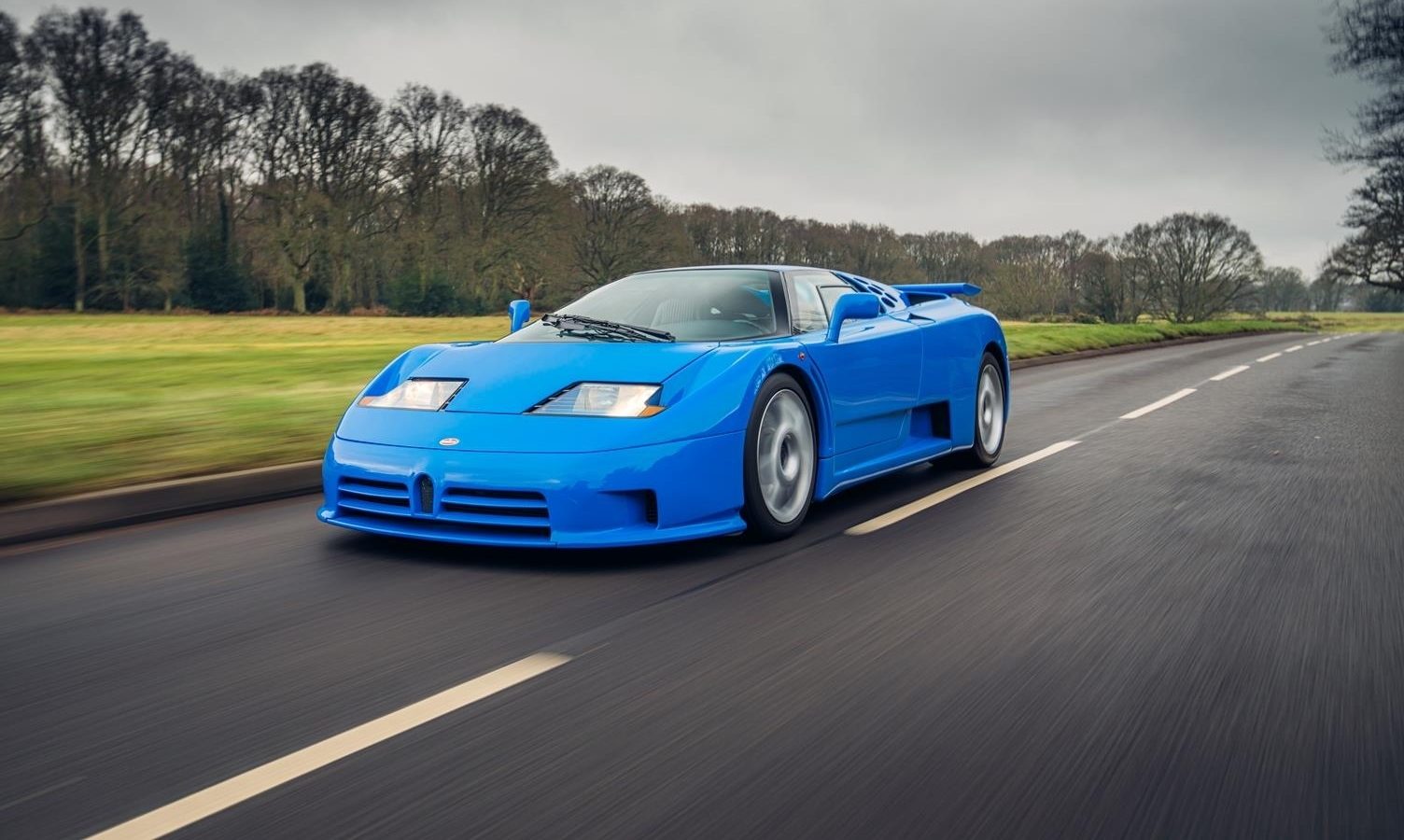 Could this Bugatti EB110 with matching bags be the ultimate road-tripper?
