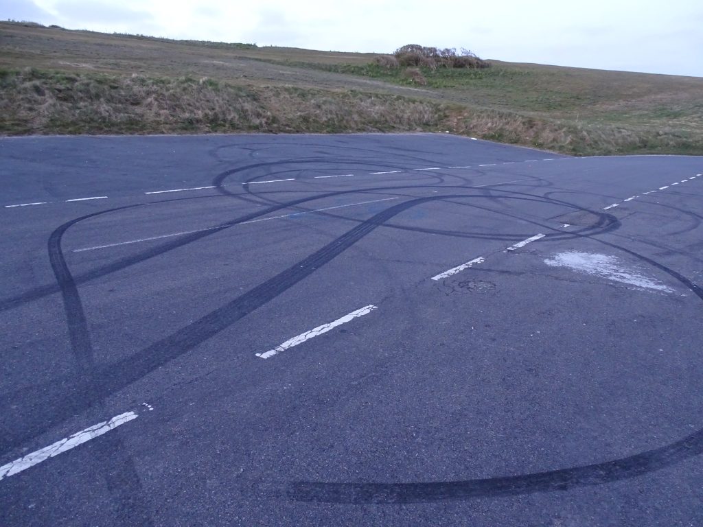 Burnout marks on the road at Beachy Head