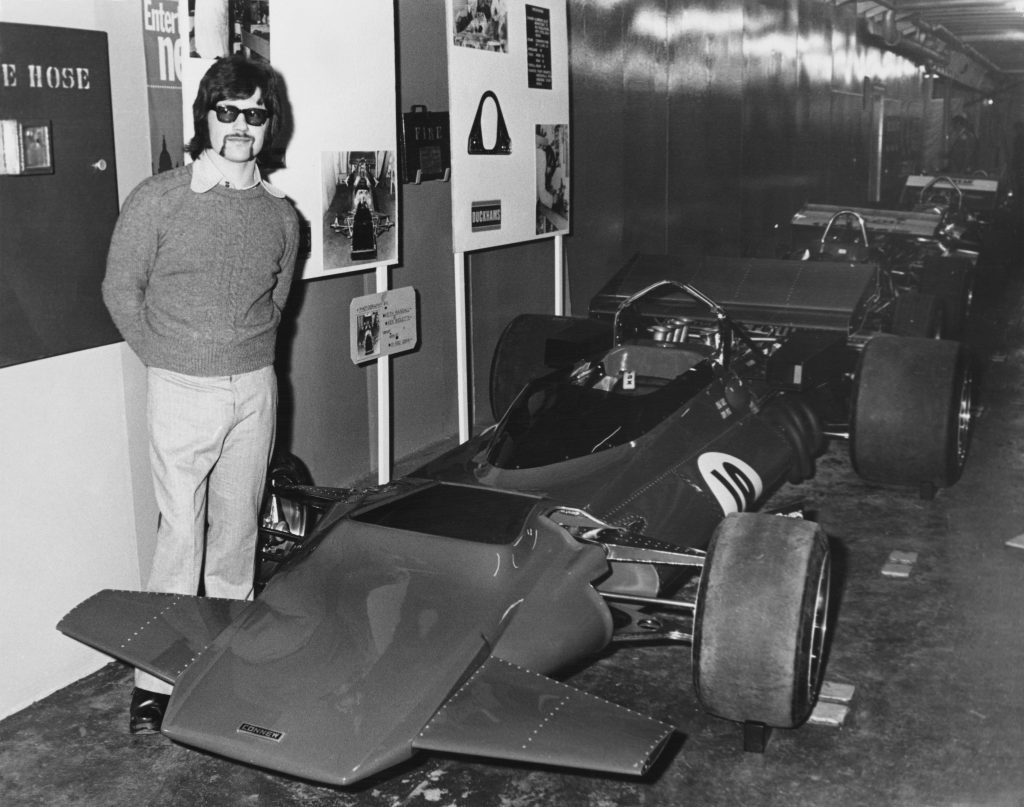 Peter Connew stands beside his own designed and garage built Connew Racing Team Connew PC1 Ford V8 Formula One Grand Prix car at the Evening News Motor Racing Show held aboard the Townsend Thoresen car ferry Free Enterprise II on 31 December 1971 at London, United Kingdom. (Photo by Jimmy Wilds/ Keystone/ Hulton Archive/Getty Images).