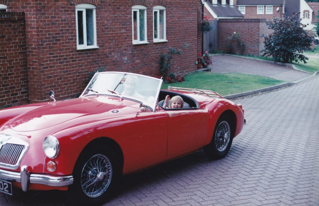 Charlotte Vowden with her grandfather Dodo in the MGA