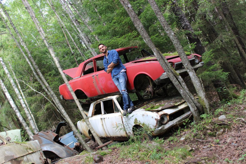 Philipp in a "car cemetery" in Sweden