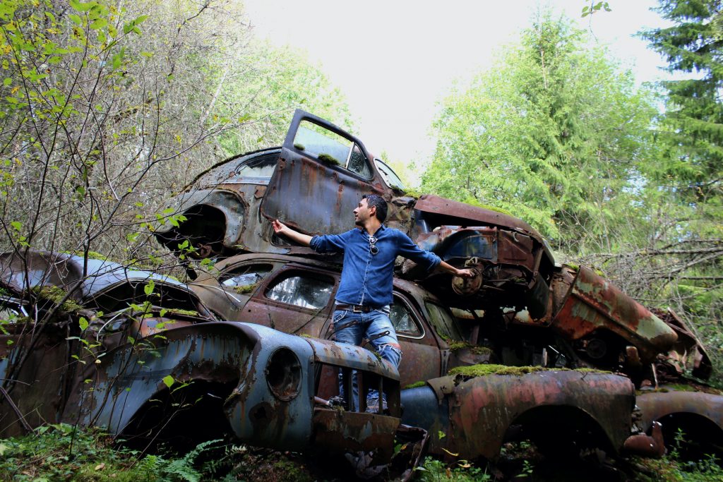 Philipp in a "car cemetery" in Sweden