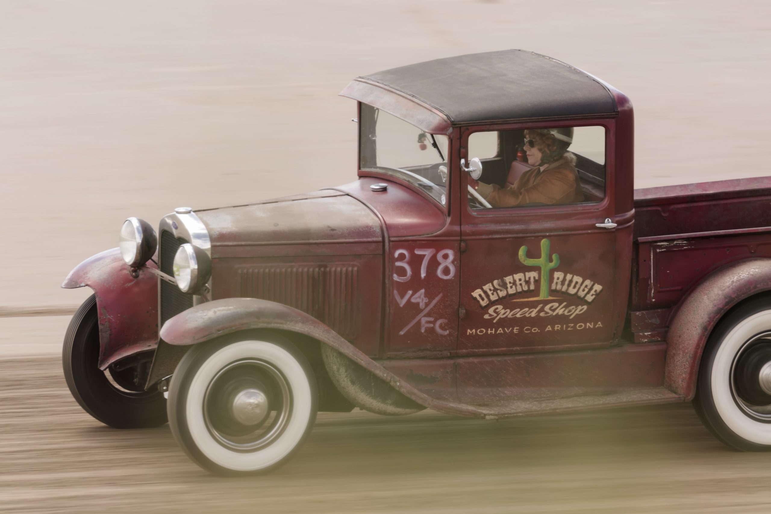 Lisa Coombes driving her hot rod at Pendine Sands