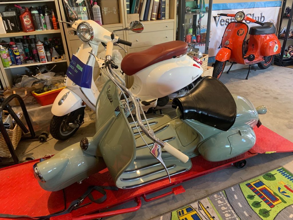 A 1946 Vespa 90, a 2016 Vespa Primavera, and a 1974 Piaggio Vespa 125 Primavera