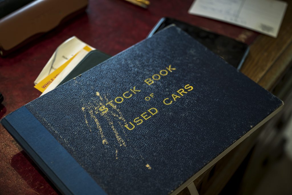 Michael Fisher's stock and used car inventory book