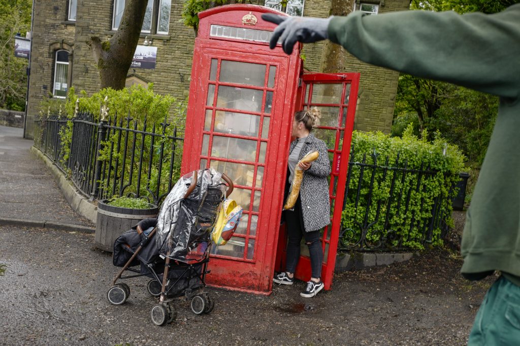 A red telephone box used as a food bank