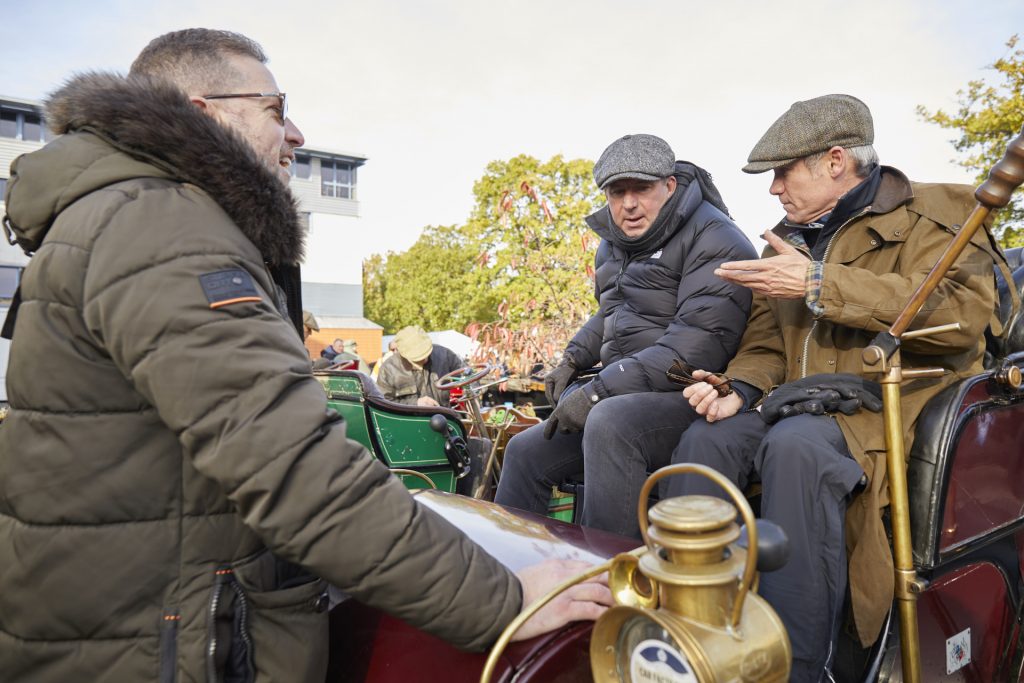 James Wood and Mark Roper of Hagerty compare notes with Paul Cowland at the 2021 Veteran Car Run