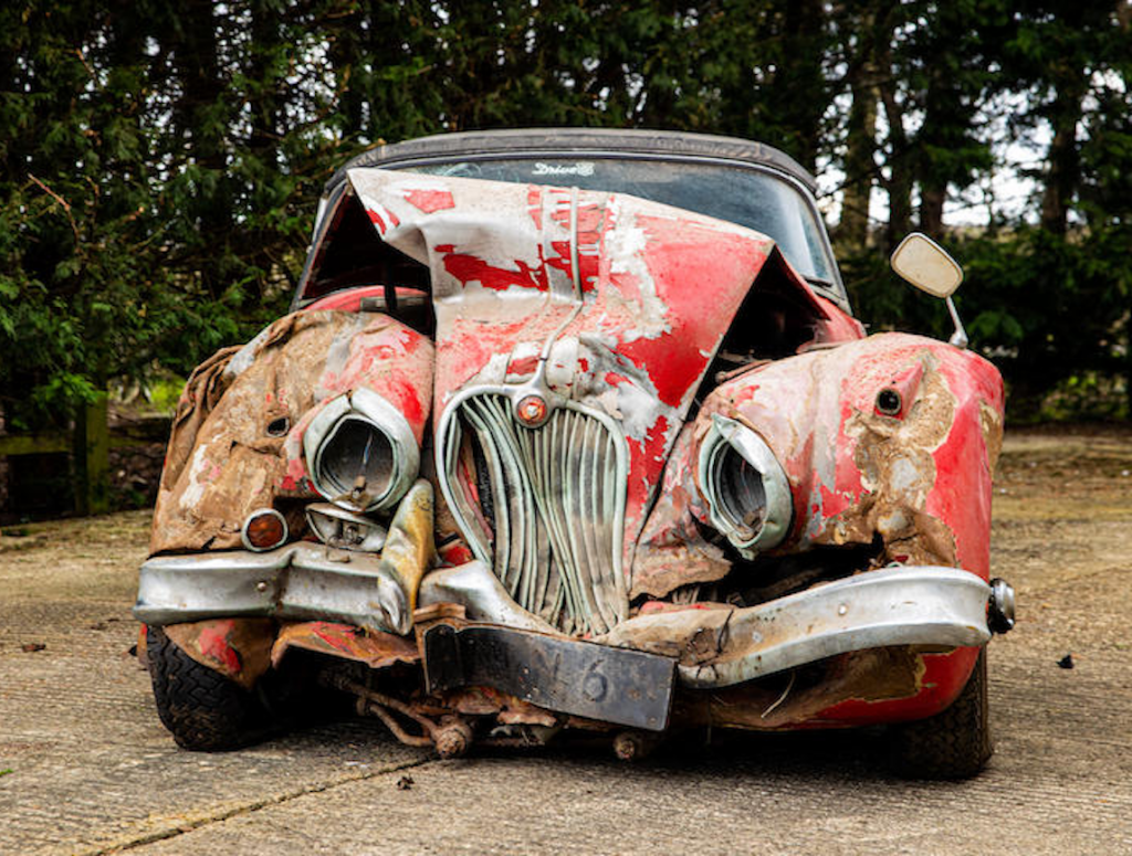 Bonhams crashed Jaguar XK150 fetches £90000