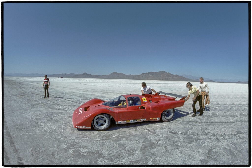 Newman looks on as a crew pus-starts the Ferrari 512 as Milt Minter heads onto the circuit, Bonneville Salt Flats, September 1974