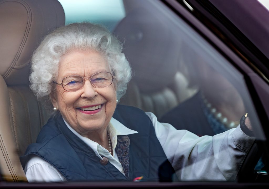Queen Elizabeth II seen driving her Range Rover, at Windsor Castle in 2021.