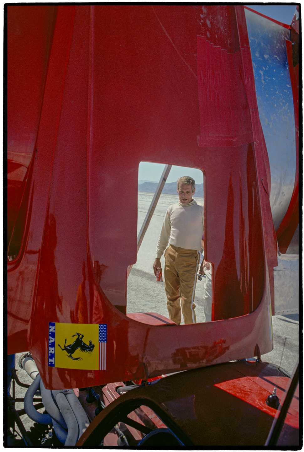 Paul New man seen through engine cover of Ferrari 512M