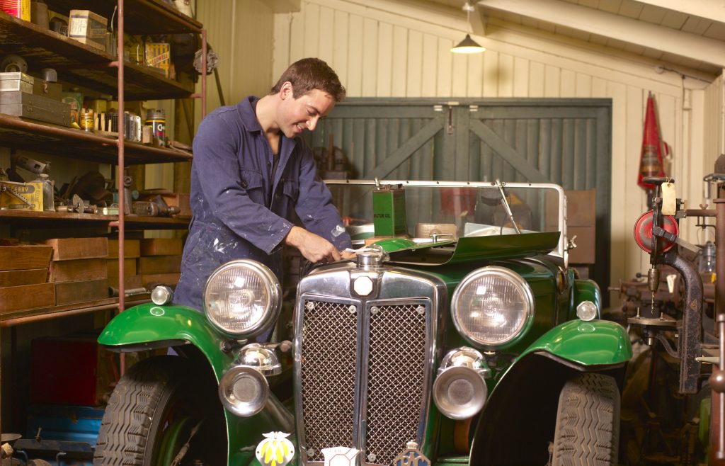 Mechanic working on classic MG