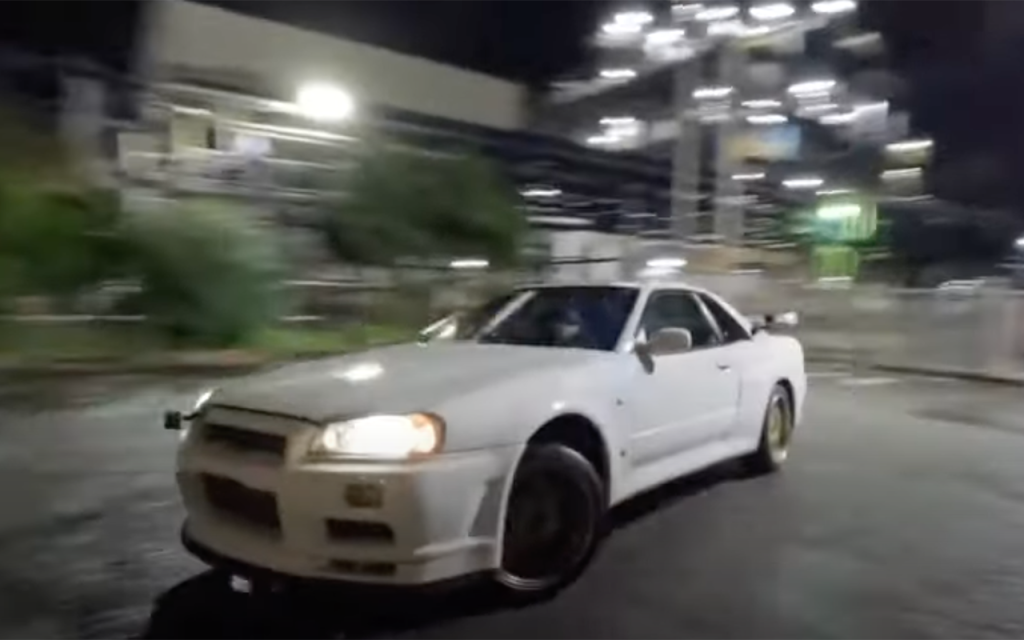 Nissan Skyline GT-R with Lewis Hamilton at wheel