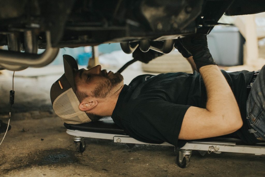 Mechanic under car