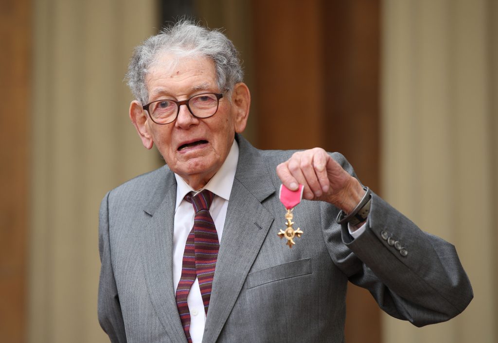 Designer Tom Karen collects his OBE, in 2019