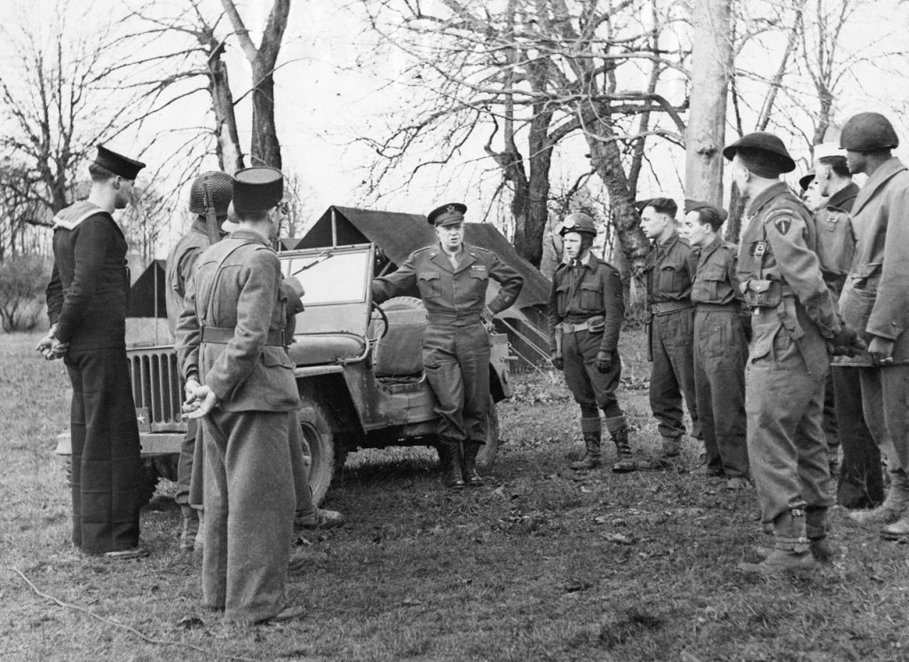 General Dwight D Eisenhower beside a jeep