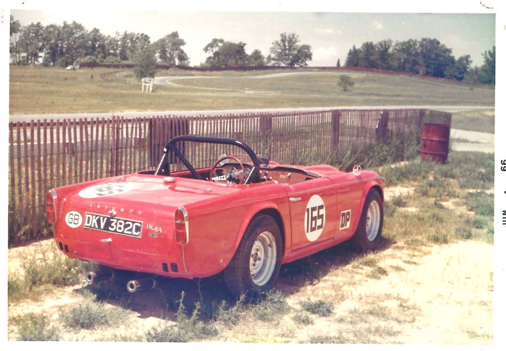 Triumph TR4A color rear three quarter at the track