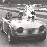 Triumph TR4A black white checkered flag