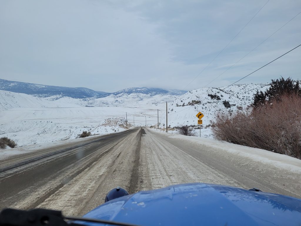 Car Collector Ms Helen Citroen out for winter drive road linear perspective