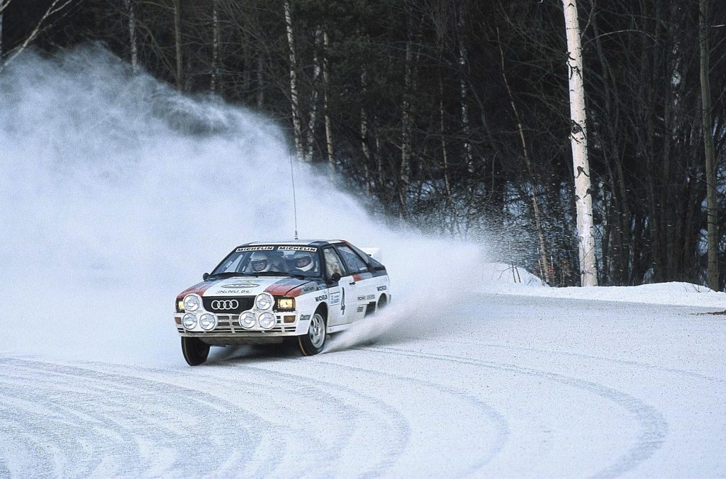 Group B Rally Car Audi racing action front three quarter cornering snow drift