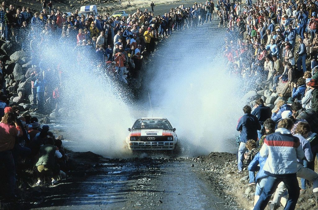 Group B Rally Car Audi racing action crowd splitting water spray