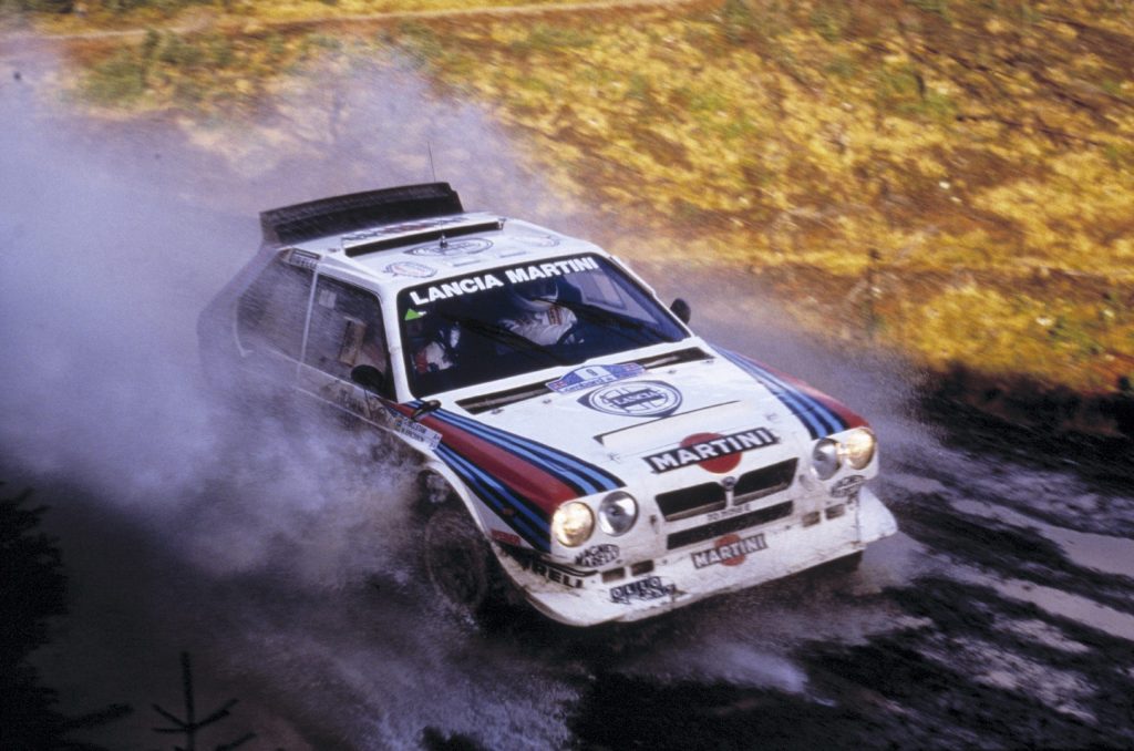 Group B Rally Car Lancia racing action high angle front three quarter