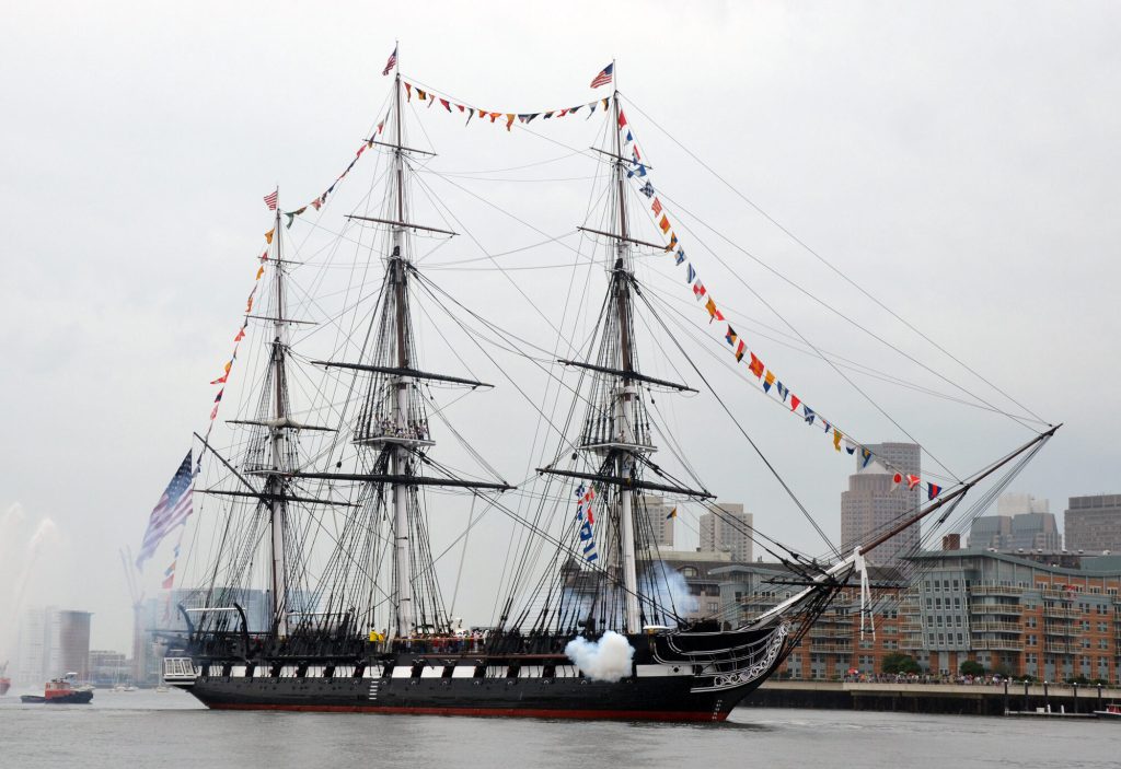 USS Constitution fires a 17-gun salute