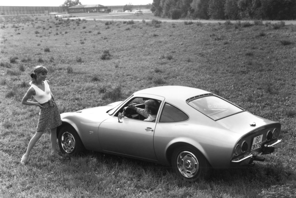 Opel GT rear 3/4 man woman