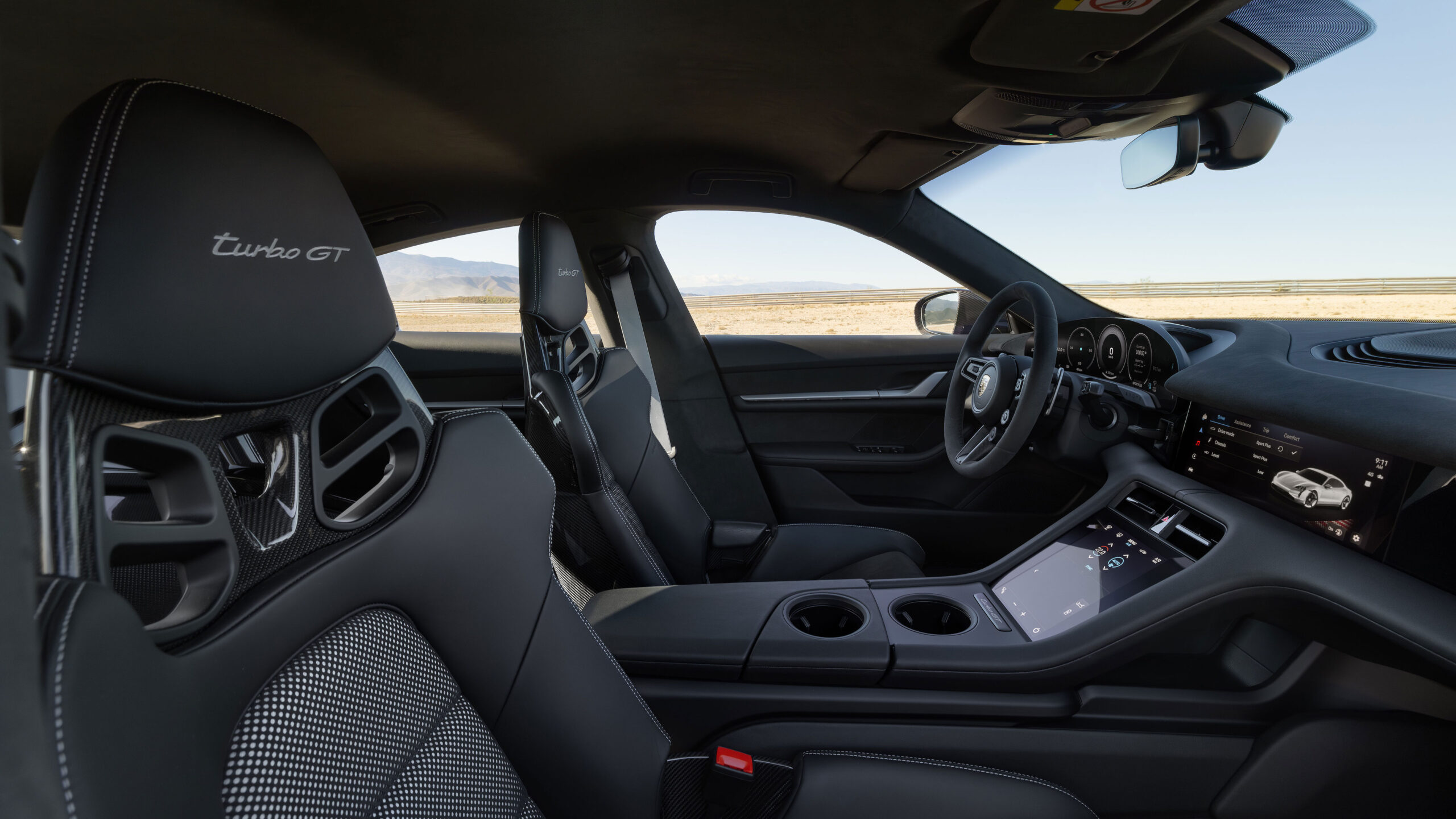 2025 Porsche Taycan Turbo GT interior seats and front cabin area through passenger's door