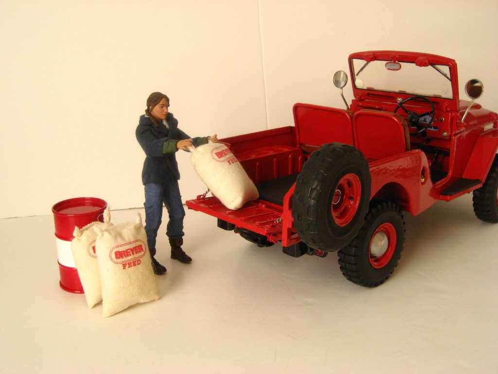 Toyota Land Cruiser model with doll